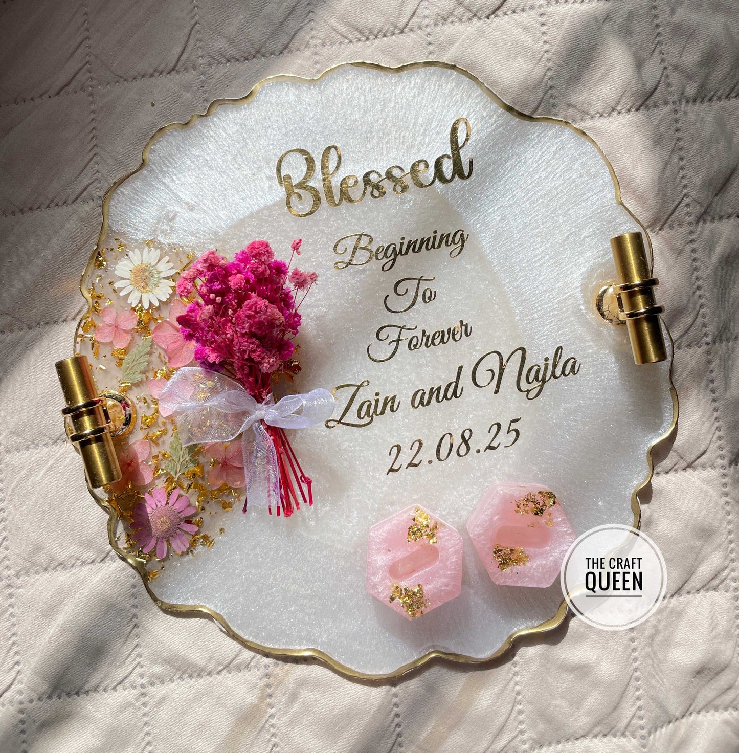 Decorative plate with floral elements and text on a quilted surface, featuring 'The Craft Queen' brand.